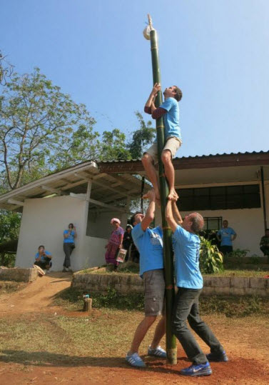 farangs climbing the pole