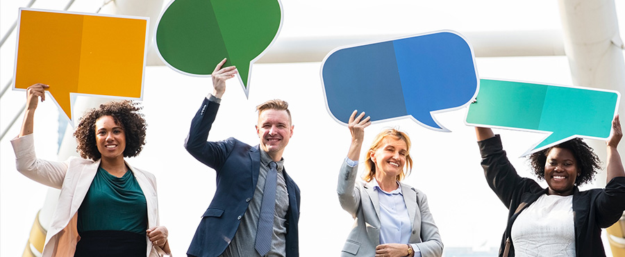 people holding comment bubble sign